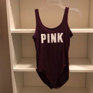 Dark maroon bodysuit.